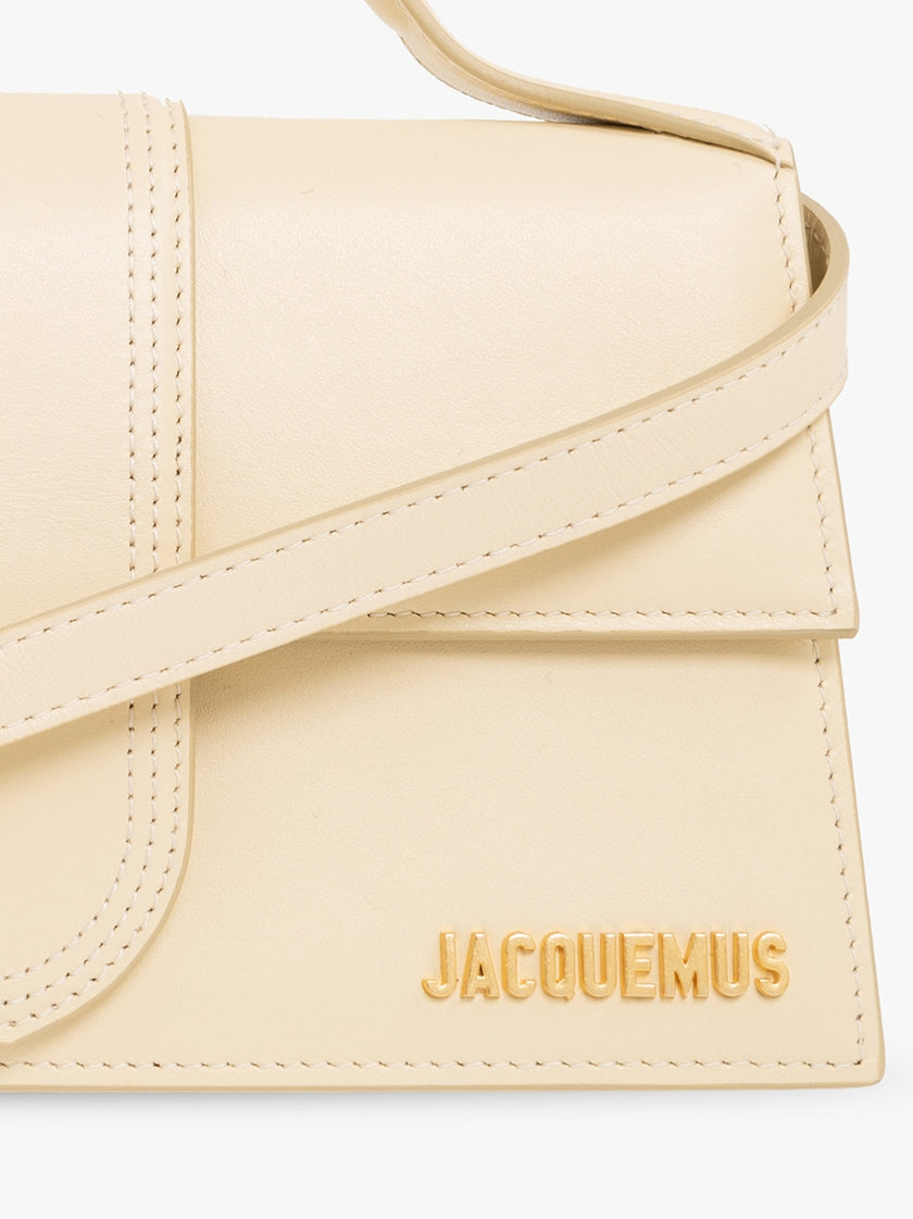 Le Grand Bambino Beige BagJACQUEMUS Gorgeous brand new, 100% Authentic Jacquemus Le Grand Bambino Beige Bag. Model: 213BA007-3060-120 Color: Beige with Gold Hardware Material: Leather Beige with adjustable shoulder strap – Small handle – Removable shoulde