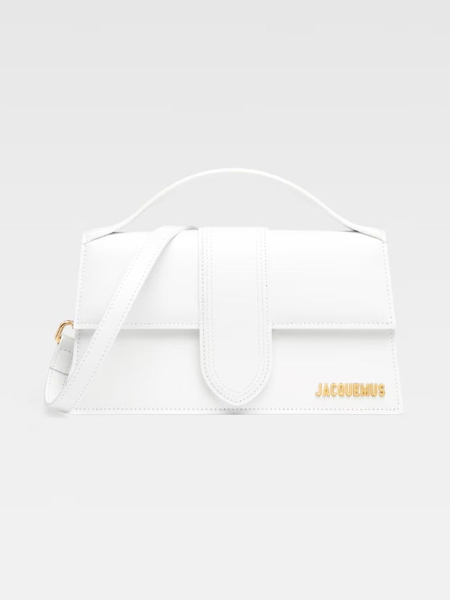 Le Grand Bambino White BagJACQUEMUS Gorgeous brand new, 100% Authentic Jacquemus Le Grand Bambino White Bag. Model: 213BA007-3000-100 Color: White with Gold Hardware Material: Leather – Adjustable shoulder strap – Small handle – Removable shoulder strap –
