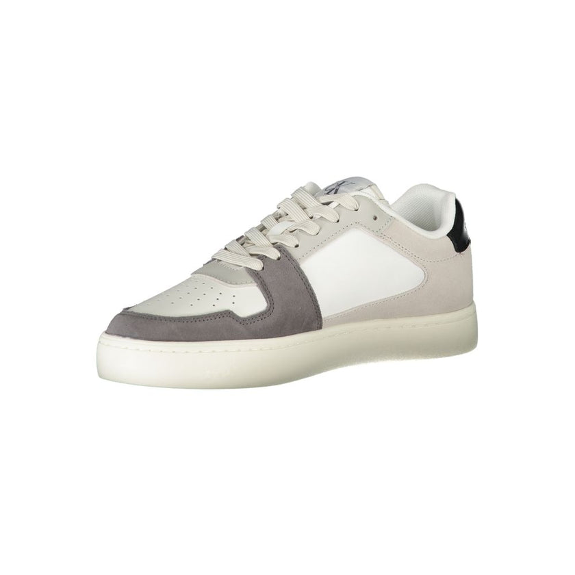White Polyester Men SneakerStep into the epitome of modern sophistication with the Calvin Klein sports shoe, where functionality meets high-fashion allure. Boasting a bold white base with striking black-green and grey accents, this footwear is a statement