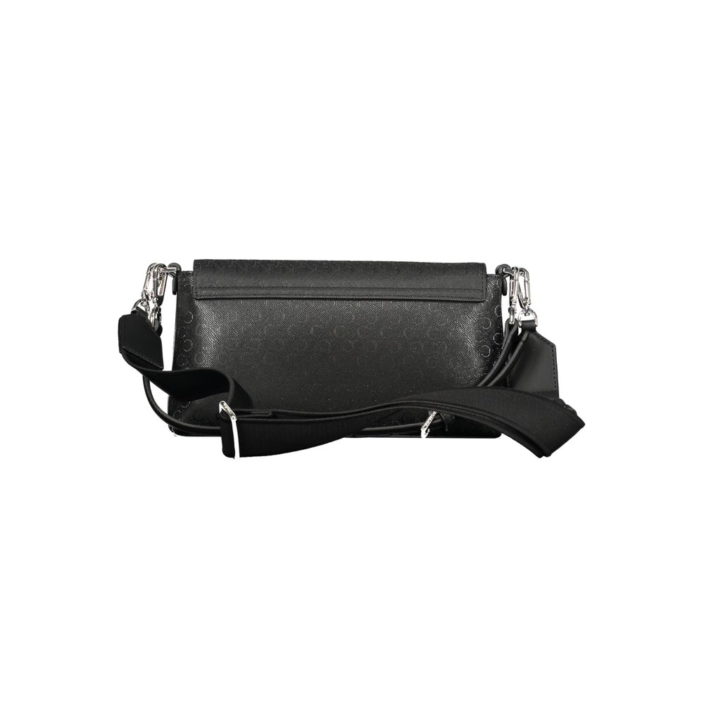 Black Polyester Women HandbagDiscover the epitome of urban elegance with this stunning Calvin Klein handbag, crafted to perfection for the fashion-forward individual. A marvel of form and function, it features a solitary shoulder handle paired with an adj