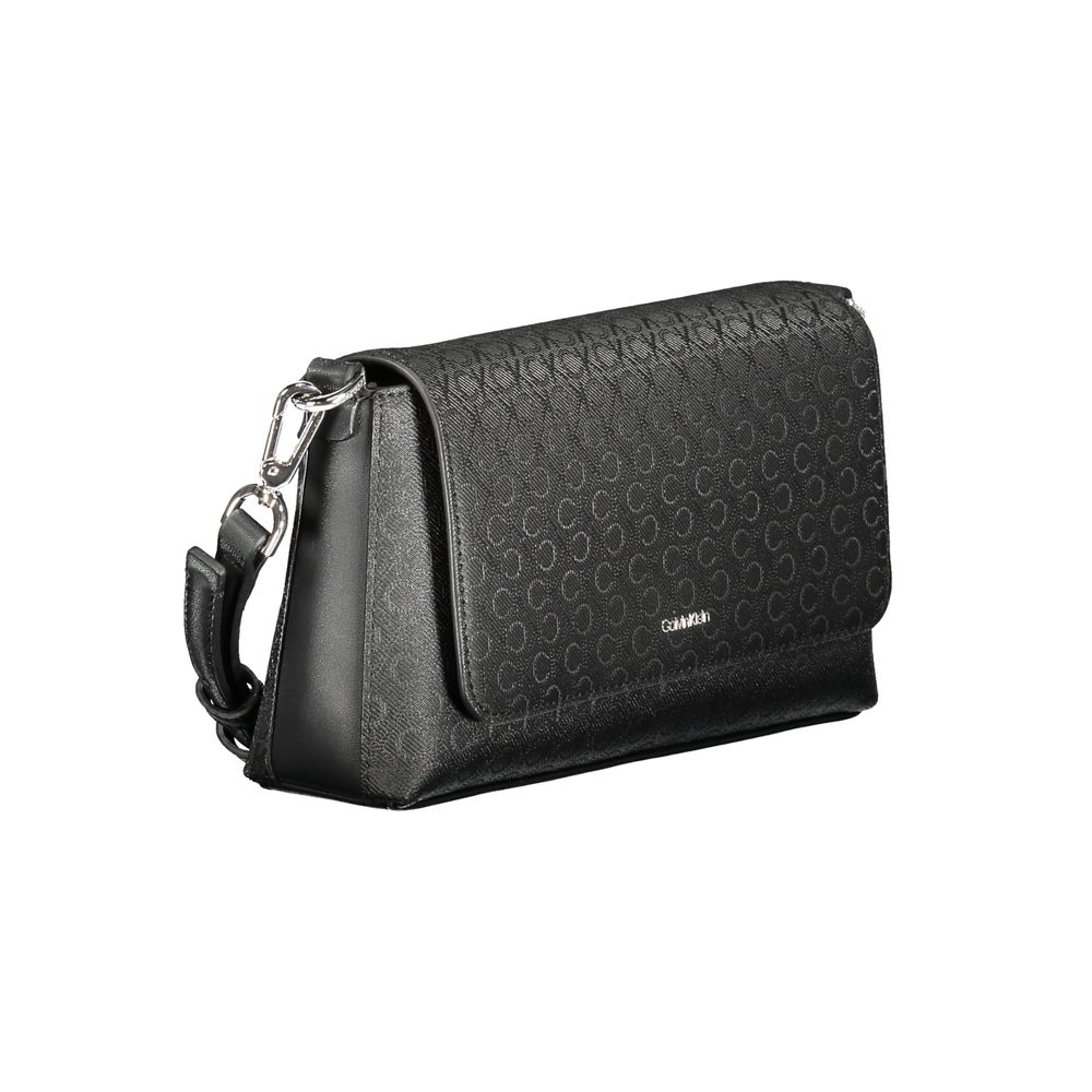 Black Polyester Women HandbagDiscover the epitome of urban elegance with this stunning Calvin Klein handbag, crafted to perfection for the fashion-forward individual. A marvel of form and function, it features a solitary shoulder handle paired with an adj