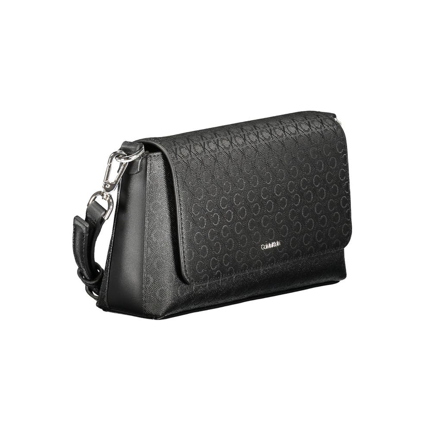 Black Polyester Women HandbagDiscover the epitome of urban elegance with this stunning Calvin Klein handbag, crafted to perfection for the fashion-forward individual. A marvel of form and function, it features a solitary shoulder handle paired with an adj