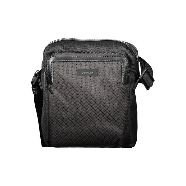 Black Polyester Men Shoulder BagElevate your accessory game with the sleek Calvin Klein Shoulder Bag — where functionality meets minimalist luxury. This piece boasts a sharp black hue enhanced by contrasting details for that touch of edge. Equipped with a