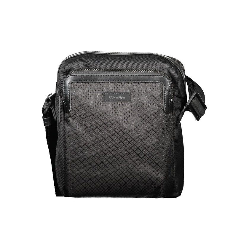 Black Polyester Men Shoulder BagElevate your accessory game with the sleek Calvin Klein Shoulder Bag — where functionality meets minimalist luxury. This piece boasts a sharp black hue enhanced by contrasting details for that touch of edge. Equipped with a
