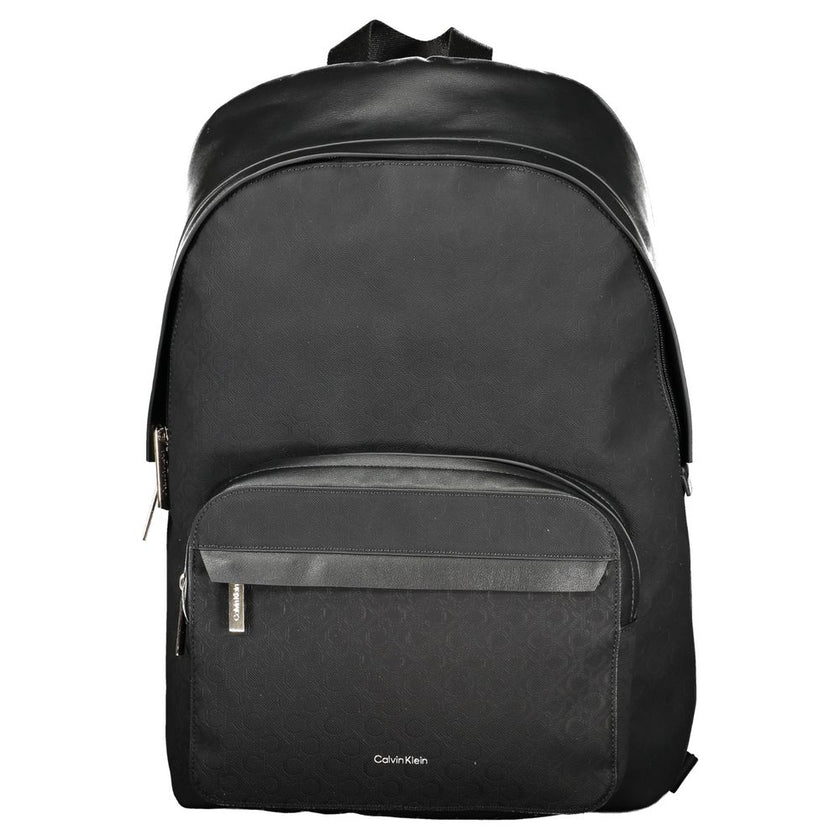 Black Polyester Men BackpackElevate your style to new heights with this sleek Calvin Klein backpack, where functionality meets fashion in a symphony of elegance. Designed for the modern urbanite, it features an external pocket for easy access, a dedicated