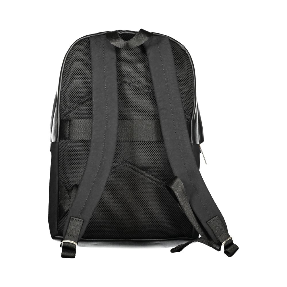 Black Polyester Men BackpackElevate your style to new heights with this sleek Calvin Klein backpack, where functionality meets fashion in a symphony of elegance. Designed for the modern urbanite, it features an external pocket for easy access, a dedicated