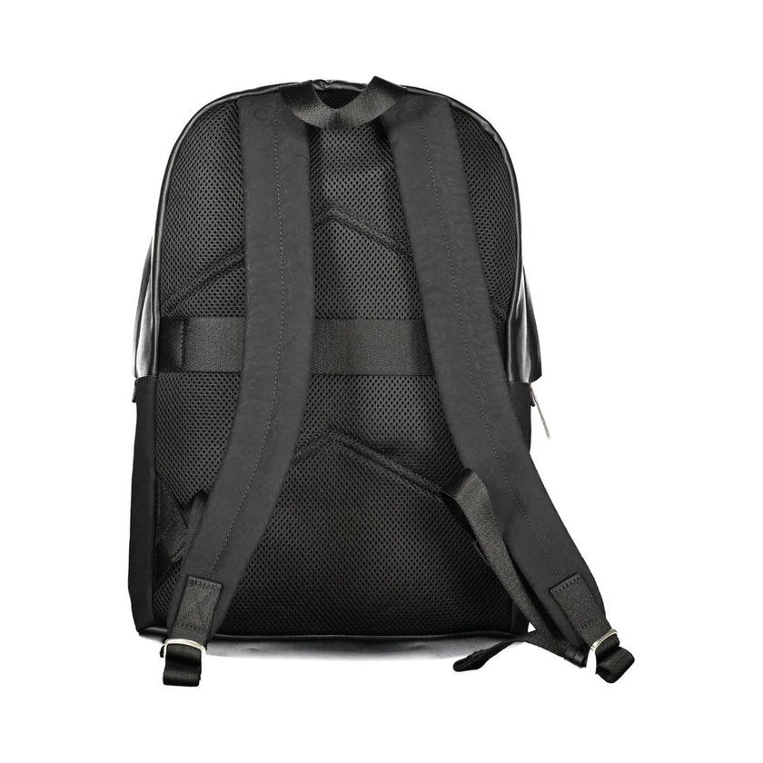 Black Polyester Men BackpackElevate your style to new heights with this sleek Calvin Klein backpack, where functionality meets fashion in a symphony of elegance. Designed for the modern urbanite, it features an external pocket for easy access, a dedicated