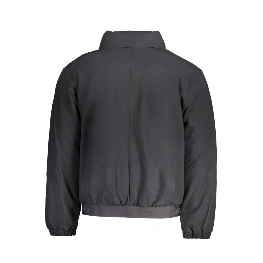 Black Polyester Men's JacketDive into the sleek sophistication of Calvin Klein with this versatile long sleeve jacket that seamlessly blends function with style. Boasting a removable hood for those unpredictable weather changes, it assures you stay ahead