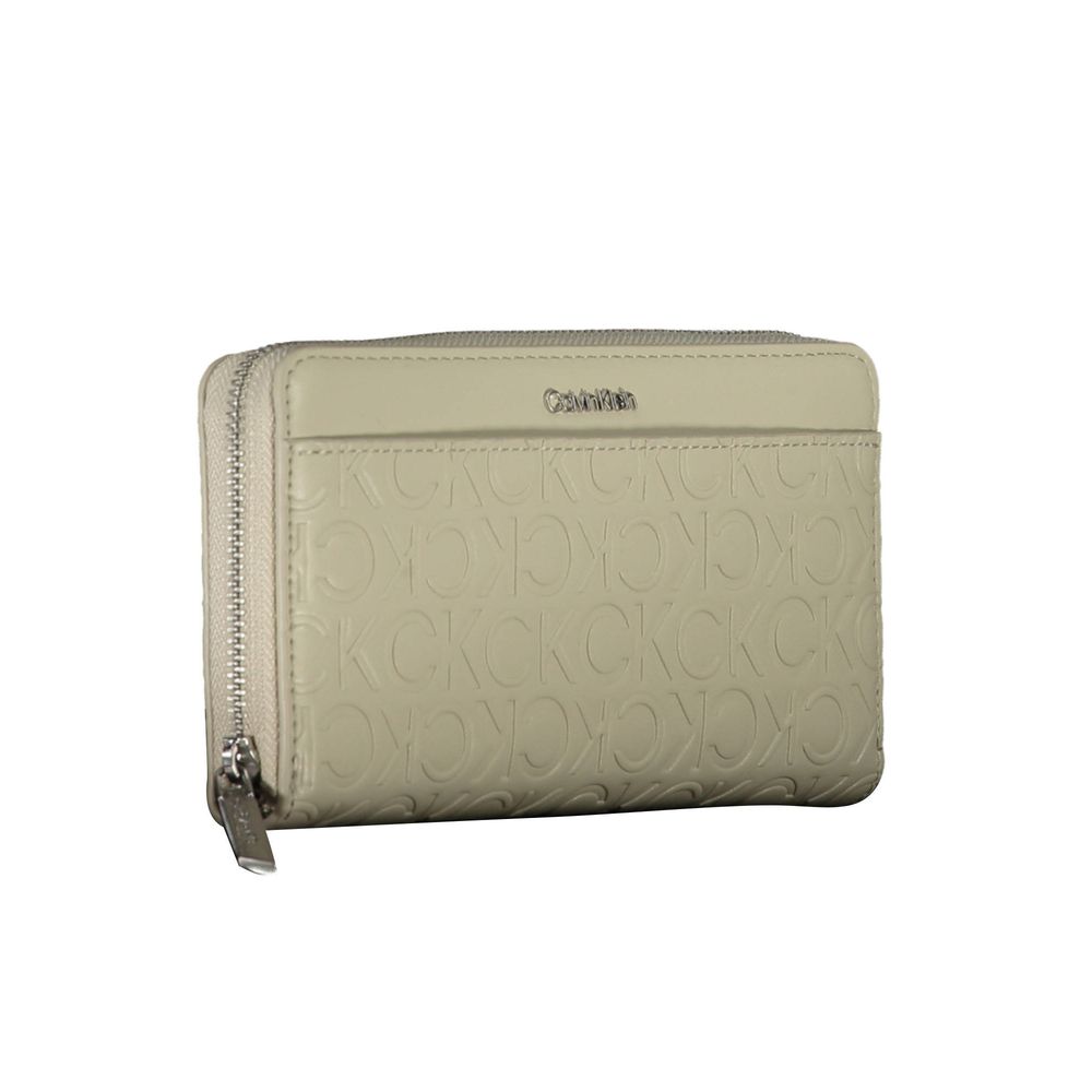 Beige Polyethylene Women WalletOutfit your essentials in the sleek silhouette of Calvin Klein’s premium wallet, crafted for the modern trendsetter. This accessory blends practicality with style, featuring a quintet of compartments to expertly organize you