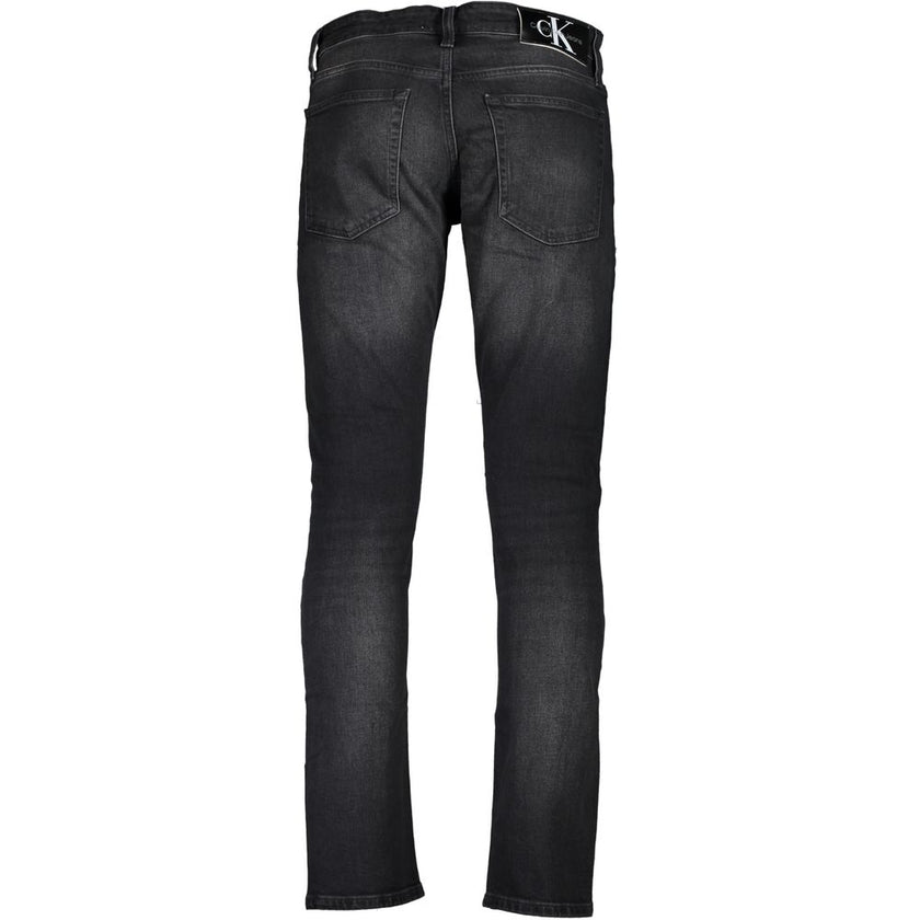Black Cotton Men JeansElevate your denim game with these sleek Calvin Klein jeans, tailored to perfection in a slim fit silhouette. Embellished with a chic washed effect and stamped proudly with the brand’s iconic logo, these jeans are the epitome of mode