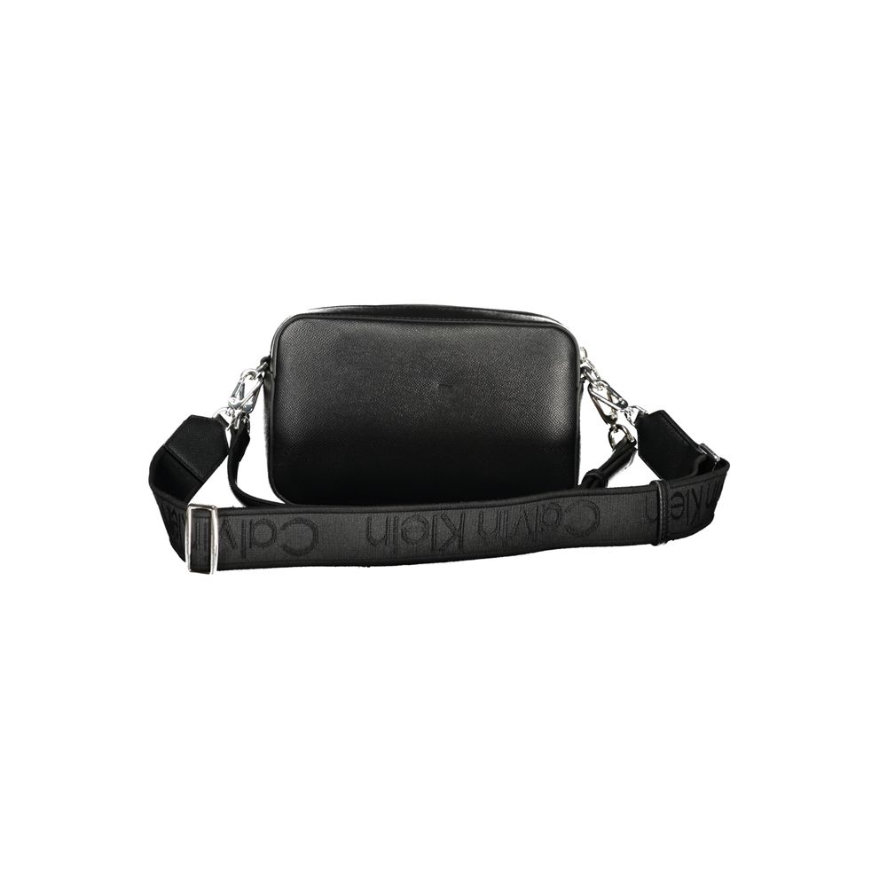Black Polyethylene Women HandbagIndulge in the epitome of sophistication with this sleek Calvin Klein handbag, a perfect blend of functionality and high-fashion allure. Featuring an adjustable and removable shoulder strap alongside a chic shoulder handle,