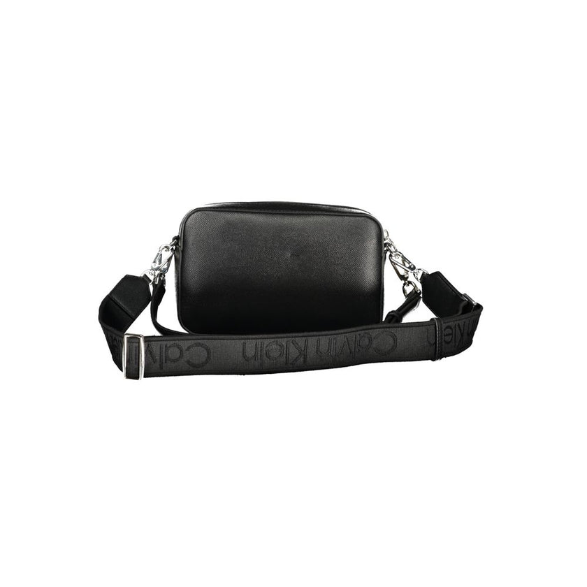 Black Polyethylene Women HandbagIndulge in the epitome of sophistication with this sleek Calvin Klein handbag, a perfect blend of functionality and high-fashion allure. Featuring an adjustable and removable shoulder strap alongside a chic shoulder handle,