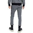 Black Cotton Men SweatpantElevate your off-duty repertoire with the Balmain cotton sweatpants, where casual meets couture. These pants feature a stark white-on-black Greek pattern print that stands out with audacity, while their drawstring and elasticated