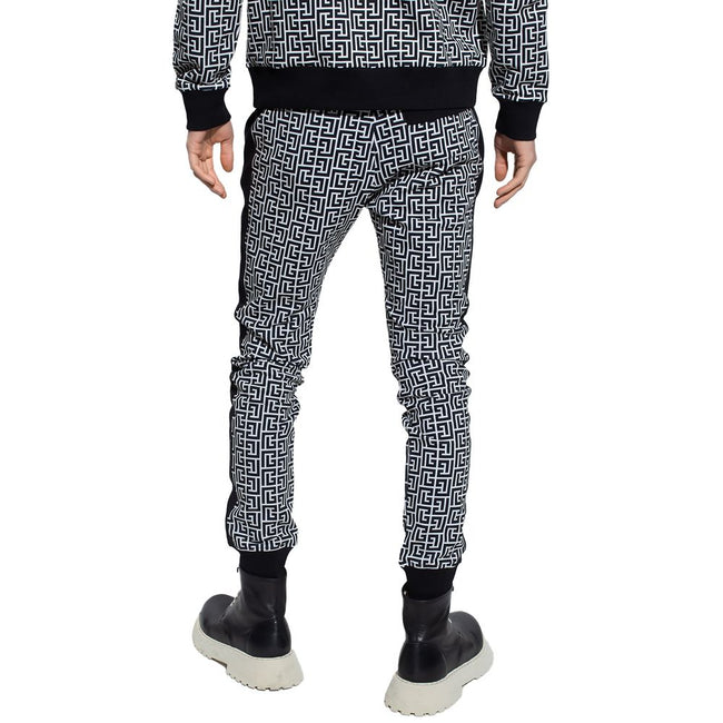 Black Cotton Men SweatpantElevate your off-duty repertoire with the Balmain cotton sweatpants, where casual meets couture. These pants feature a stark white-on-black Greek pattern print that stands out with audacity, while their drawstring and elasticated