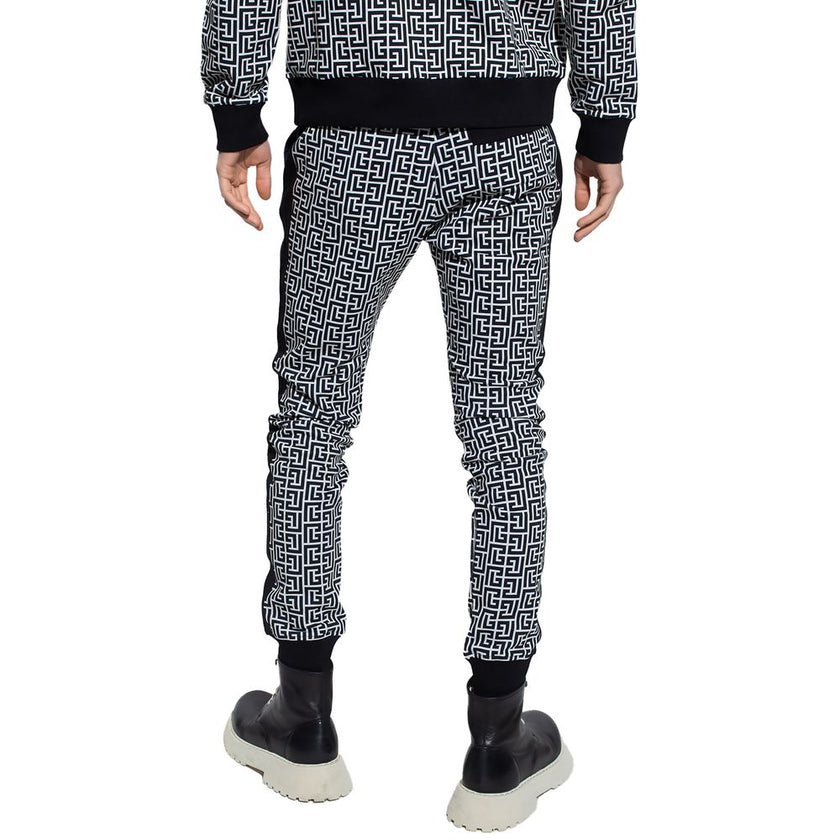 Black Cotton Men SweatpantElevate your off-duty repertoire with the Balmain cotton sweatpants, where casual meets couture. These pants feature a stark white-on-black Greek pattern print that stands out with audacity, while their drawstring and elasticated