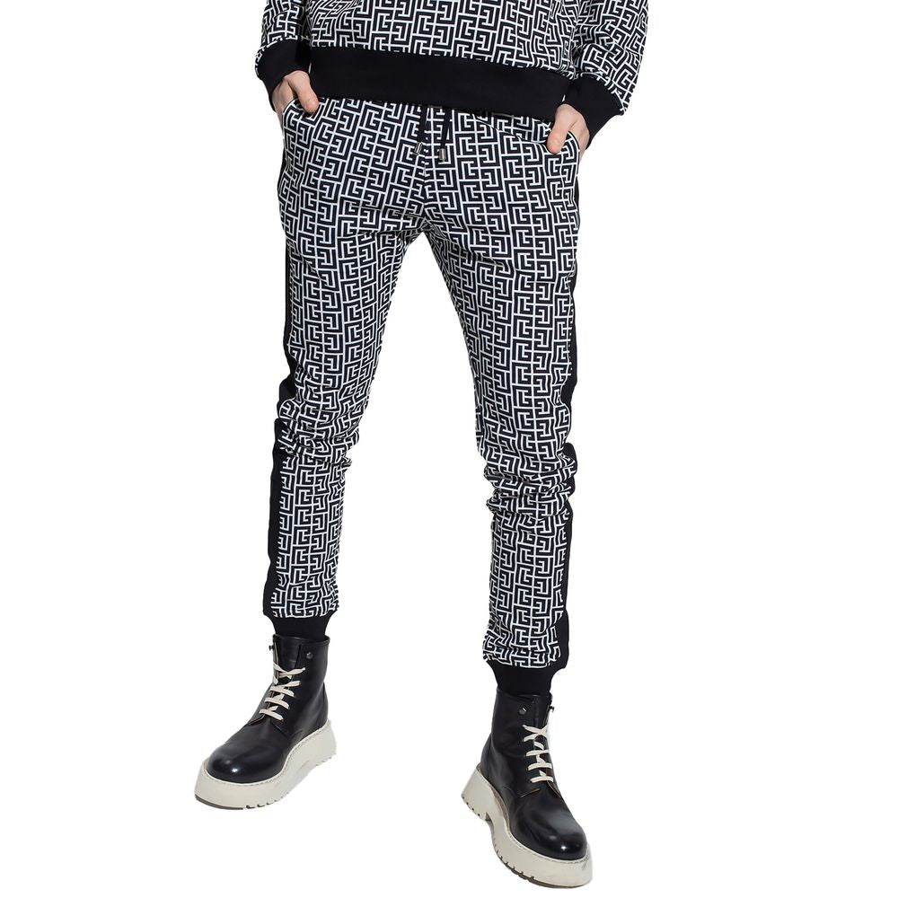 Black Cotton Men SweatpantElevate your off-duty repertoire with the Balmain cotton sweatpants, where casual meets couture. These pants feature a stark white-on-black Greek pattern print that stands out with audacity, while their drawstring and elasticated