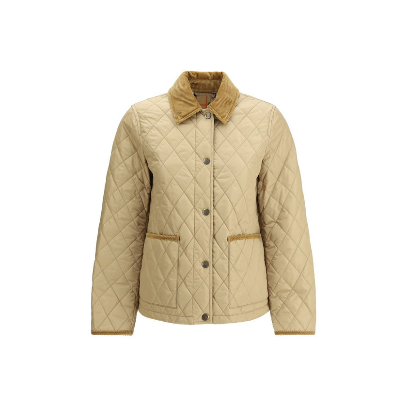 Quilted JacketBurberry’s Quilted Jacket is made of lightweight nylon with a cotton twill interior decorated with the classic Burberry Check pattern in sand color. The model has a slim fit and features tone-on-tone corduroy collar and trim for a refined, u