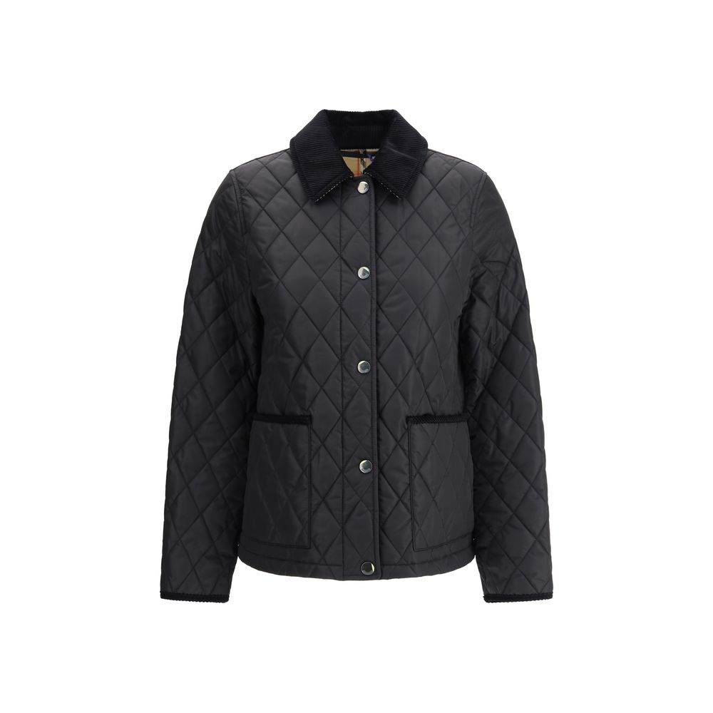 Quilted JacketBurberry’s Quilted Jacket is made of lightweight nylon with a cotton twill interior decorated with the classic Burberry Check pattern in sand color. The model has a slim fit and features tone-on-tone corduroy collar and trim for a refined, u