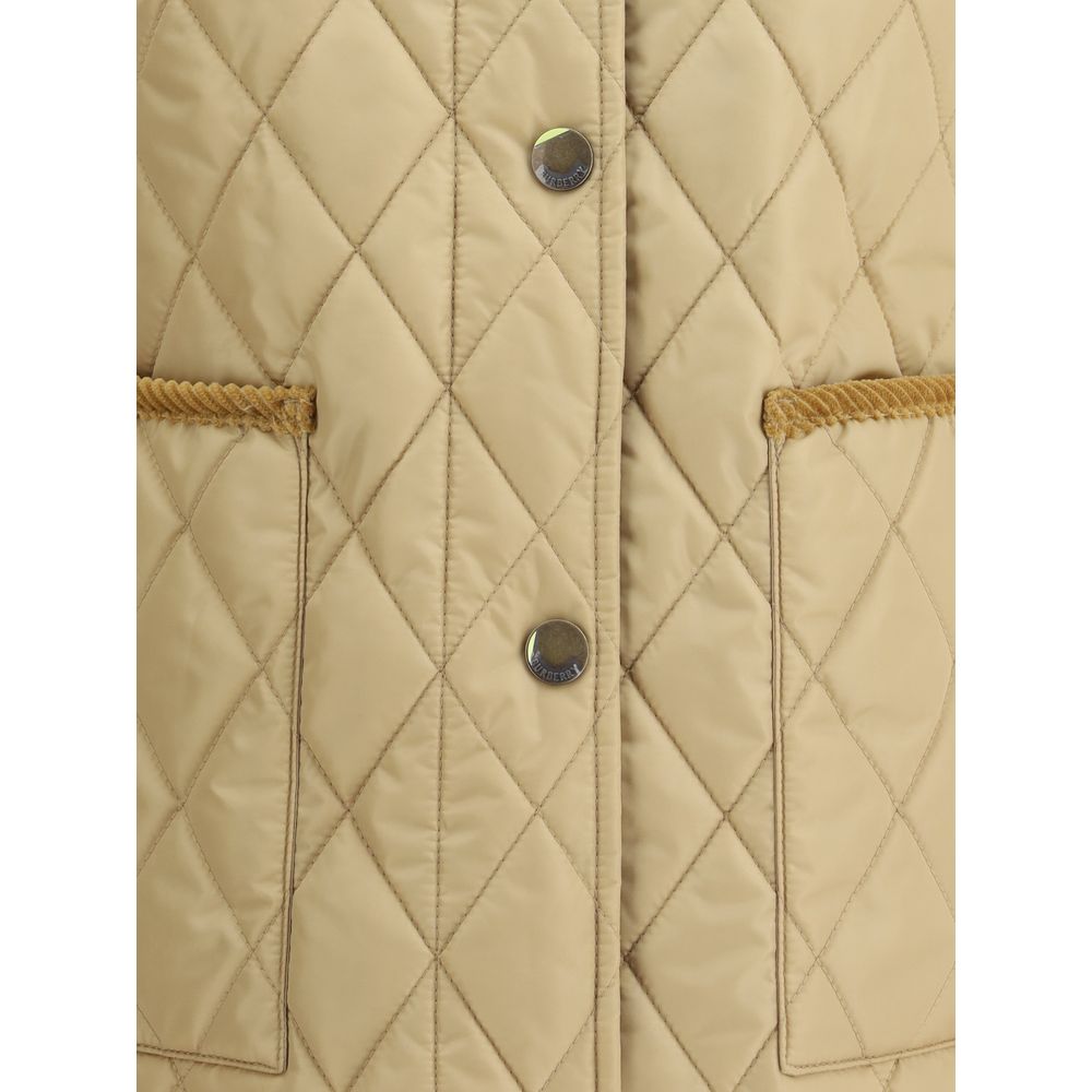 Quilted JacketBurberry’s Quilted Jacket is made of lightweight nylon with a cotton twill interior decorated with the classic Burberry Check pattern in sand color. The model has a slim fit and features tone-on-tone corduroy collar and trim for a refined, u