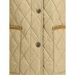 Quilted JacketBurberry’s Quilted Jacket is made of lightweight nylon with a cotton twill interior decorated with the classic Burberry Check pattern in sand color. The model has a slim fit and features tone-on-tone corduroy collar and trim for a refined, u