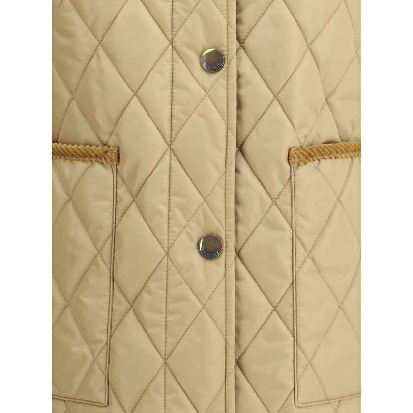 Quilted JacketBurberry’s Quilted Jacket is made of lightweight nylon with a cotton twill interior decorated with the classic Burberry Check pattern in sand color. The model has a slim fit and features tone-on-tone corduroy collar and trim for a refined, u