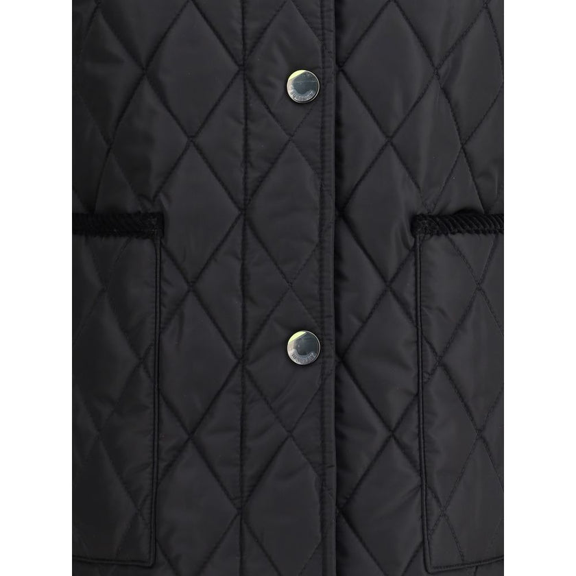 Quilted JacketBurberry’s Quilted Jacket is made of lightweight nylon with a cotton twill interior decorated with the classic Burberry Check pattern in sand color. The model has a slim fit and features tone-on-tone corduroy collar and trim for a refined, u
