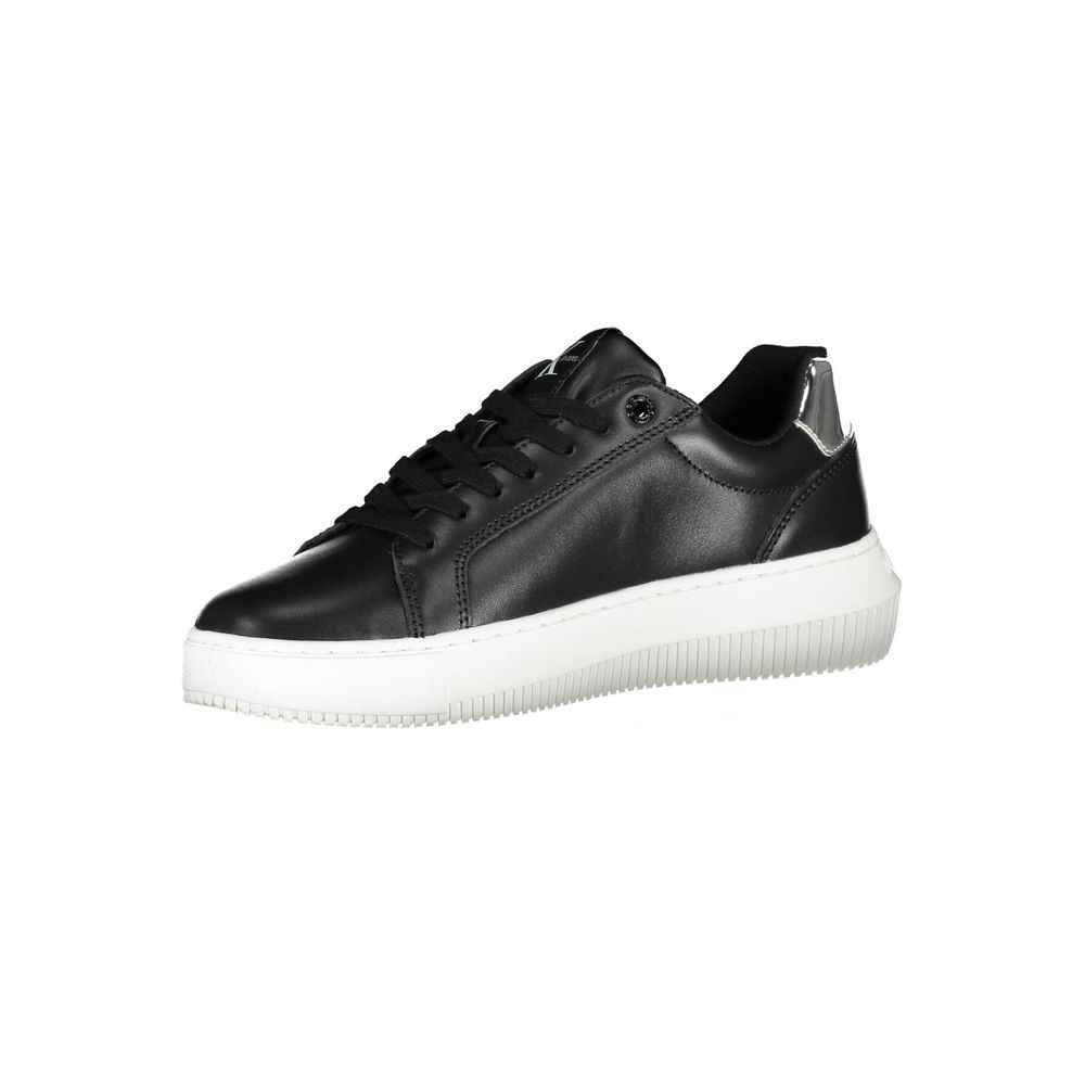 Black Polyester Women SneakerDare to stand out with Calvin Klein’s striking fusion of style and sustainability. These edgy sports shoes make a bold statement with eye-catching contrasting details and the iconic Calvin Klein logo splashed across a vibrant,
