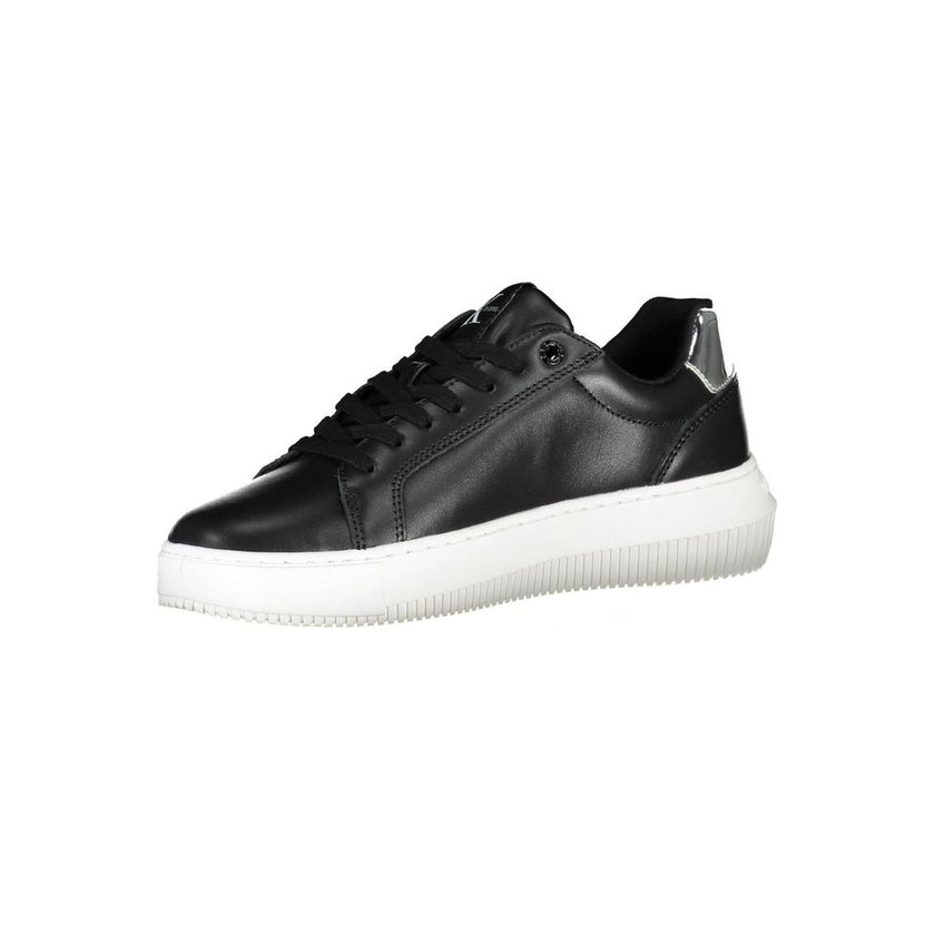 Black Polyester Women SneakerDare to stand out with Calvin Klein’s striking fusion of style and sustainability. These edgy sports shoes make a bold statement with eye-catching contrasting details and the iconic Calvin Klein logo splashed across a vibrant,