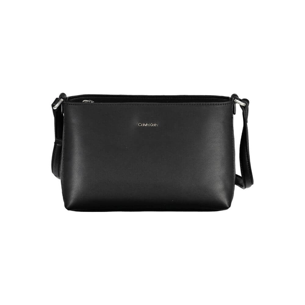 Black Polyester Women HandbagMake a bold statement wherever you go with the Calvin Klein adjustable shoulder bag. Crafted for the modern trendsetter, this sleek black handbag boasts a minimalist design with a pronounced logo, combining functionality with