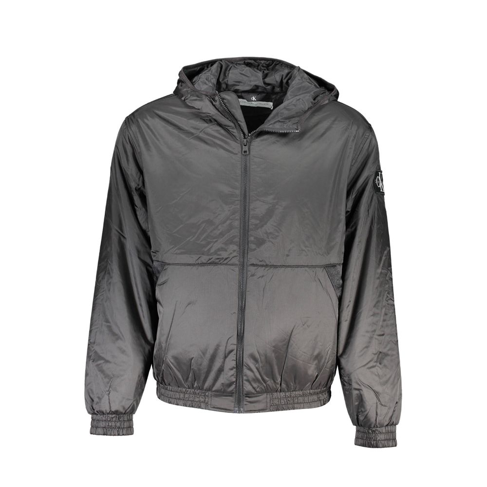 Black Recycled Polyester Men JacketElevate your outerwear collection with the sleek Calvin Klein Long Sleeved Jacket – where sophistication meets sustainability. Crafted from 100% recycled polyester, this hooded marvel balances environmental consciousness