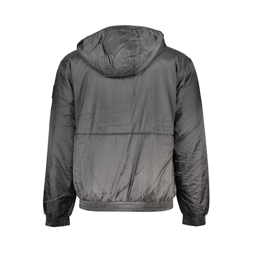 Black Recycled Polyester Men JacketElevate your outerwear collection with the sleek Calvin Klein Long Sleeved Jacket – where sophistication meets sustainability. Crafted from 100% recycled polyester, this hooded marvel balances environmental consciousness