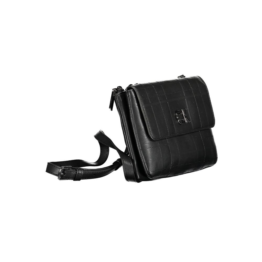 Black Polyester Women HandbagElevate your accessory game with this sophisticated and versatile Calvin Klein shoulder bag. Meticulously crafted from a blend of 51% Polyester and 49% Polyethylene, it offers sustainability with a luxe edge. The adjustable an