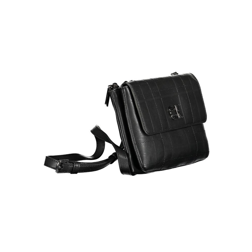 Black Polyester Women HandbagElevate your accessory game with this sophisticated and versatile Calvin Klein shoulder bag. Meticulously crafted from a blend of 51% Polyester and 49% Polyethylene, it offers sustainability with a luxe edge. The adjustable an