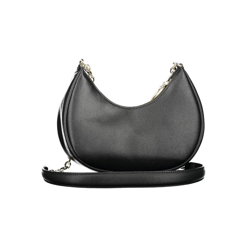 Black Polyester Women HandbagMake a powerful statement with Calvin Klein’s eco-conscious yet stunningly sophisticated shoulder bag. Crafted from a mixture of polyester and polyethylene, this sleek accessory boasts a durable and stylish chain that drapes e