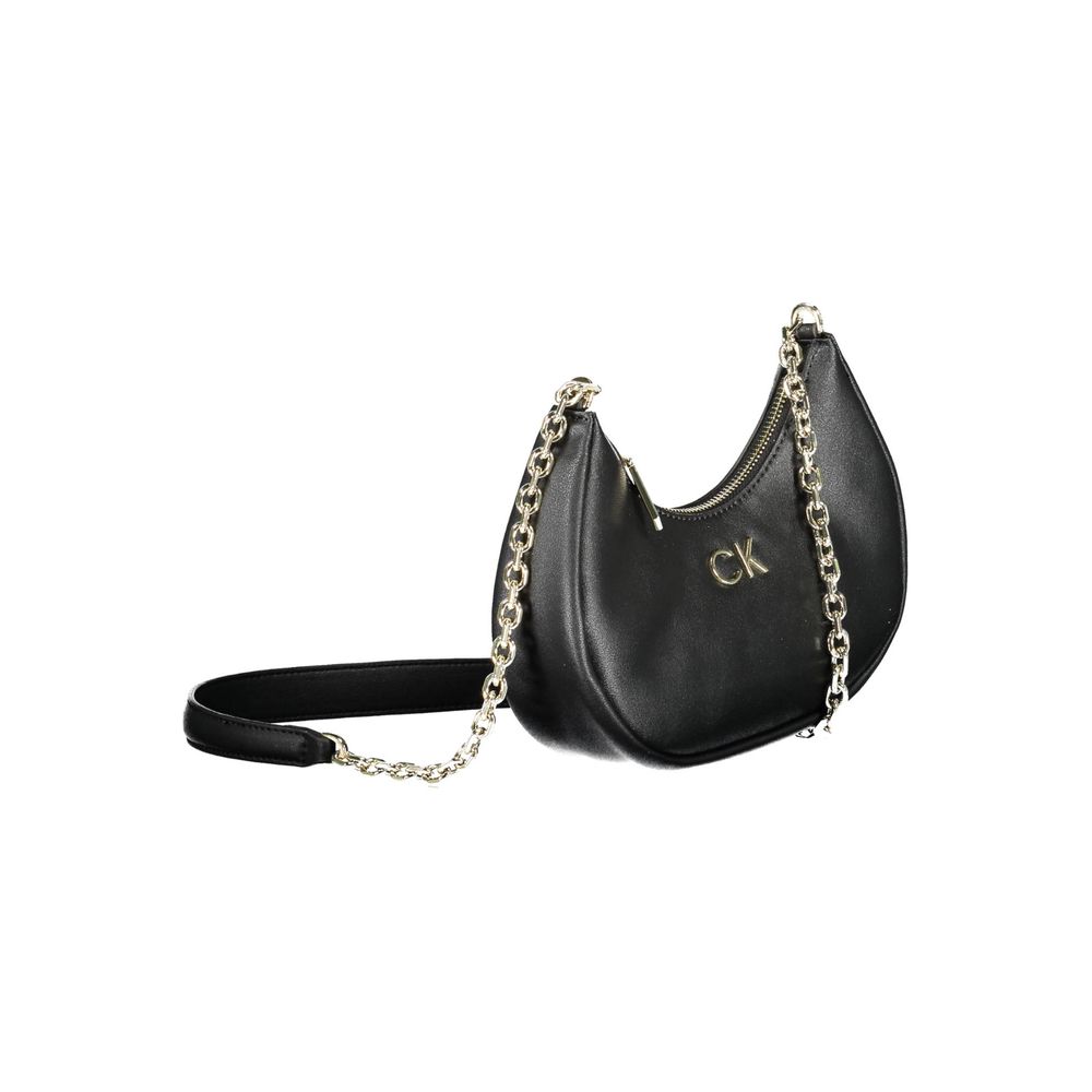 Black Polyester Women HandbagMake a powerful statement with Calvin Klein’s eco-conscious yet stunningly sophisticated shoulder bag. Crafted from a mixture of polyester and polyethylene, this sleek accessory boasts a durable and stylish chain that drapes e