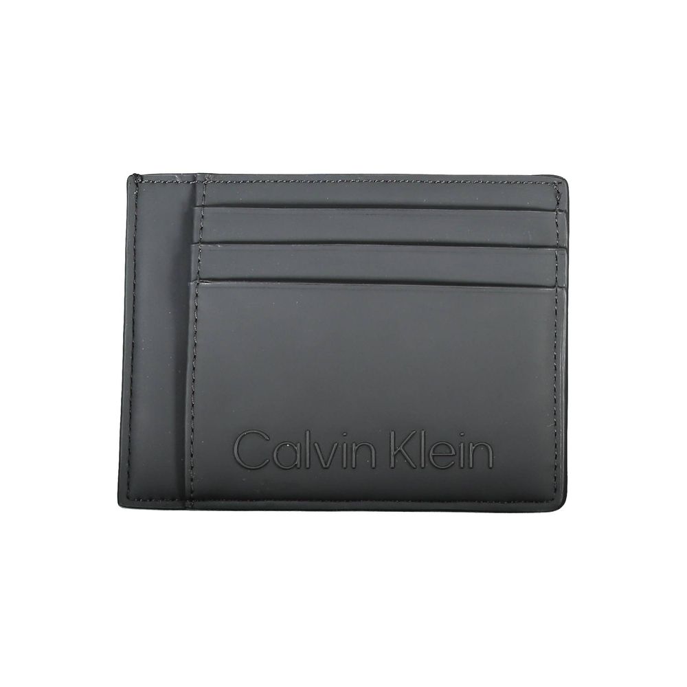 Black Polyester Men WalletElevate your essentials with Calvin Klein’s sleek card holder. The perfect blend of functionality and style, this compact accessory is designed to keep your cards organized while maintaining a sharp, fashion-forward edge. Featuri