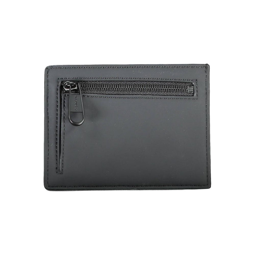 Black Polyester Men WalletElevate your essentials with Calvin Klein’s sleek card holder. The perfect blend of functionality and style, this compact accessory is designed to keep your cards organized while maintaining a sharp, fashion-forward edge. Featuri