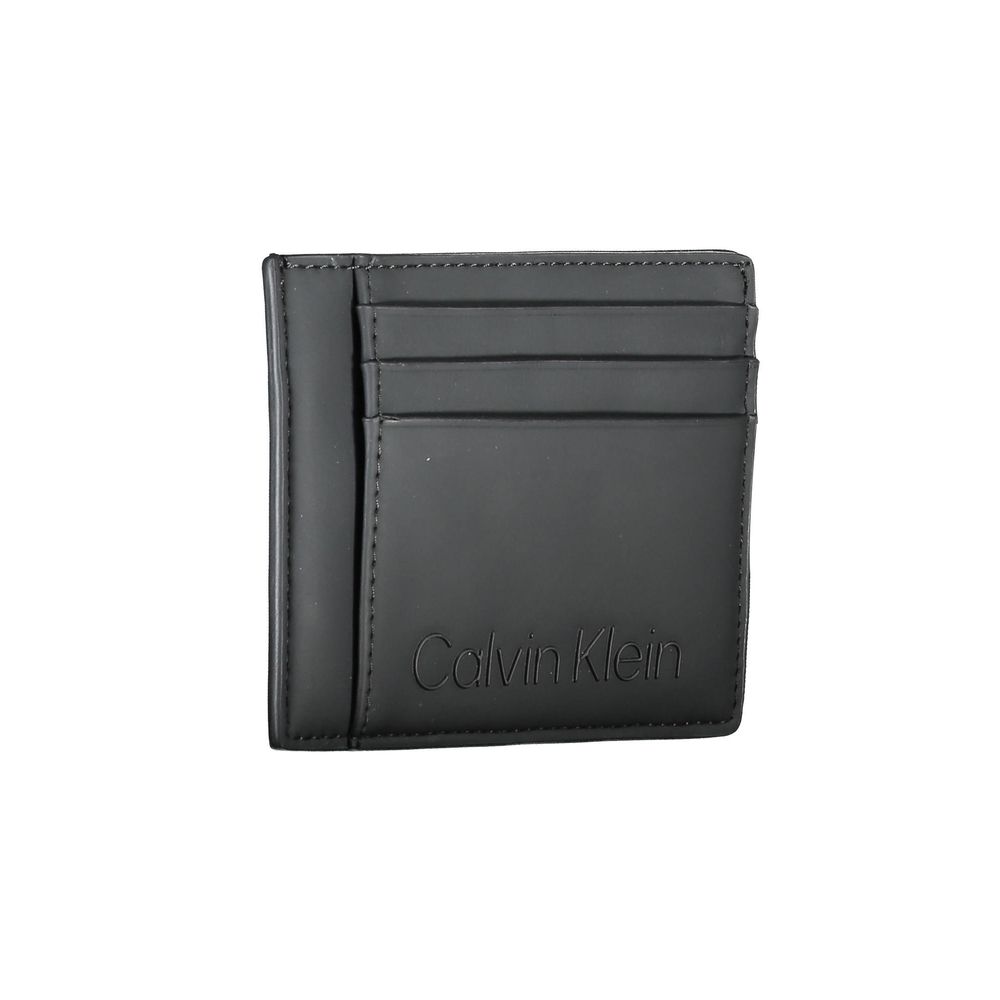 Black Polyester Men WalletElevate your essentials with Calvin Klein’s sleek card holder. The perfect blend of functionality and style, this compact accessory is designed to keep your cards organized while maintaining a sharp, fashion-forward edge. Featuri