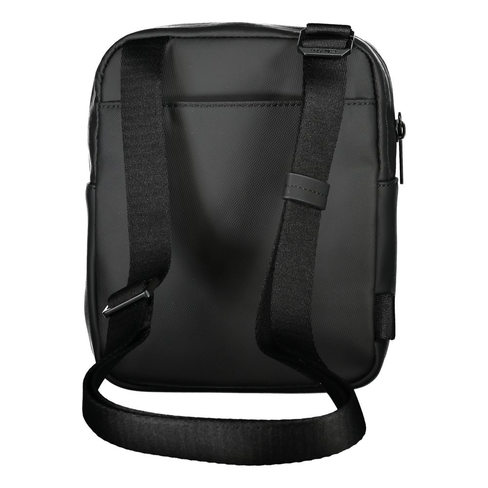 Sleek Black Recycled Polyester Shoulder BagExperience the perfect blend of functionality and style with this sleek Calvin Klein shoulder bag. Crafted for the environmentally conscious, it features an adjustable shoulder strap for customized comfort and an