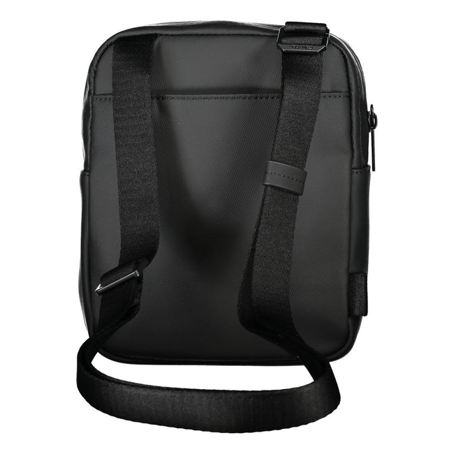 Sleek Black Recycled Polyester Shoulder BagExperience the perfect blend of functionality and style with this sleek Calvin Klein shoulder bag. Crafted for the environmentally conscious, it features an adjustable shoulder strap for customized comfort and an