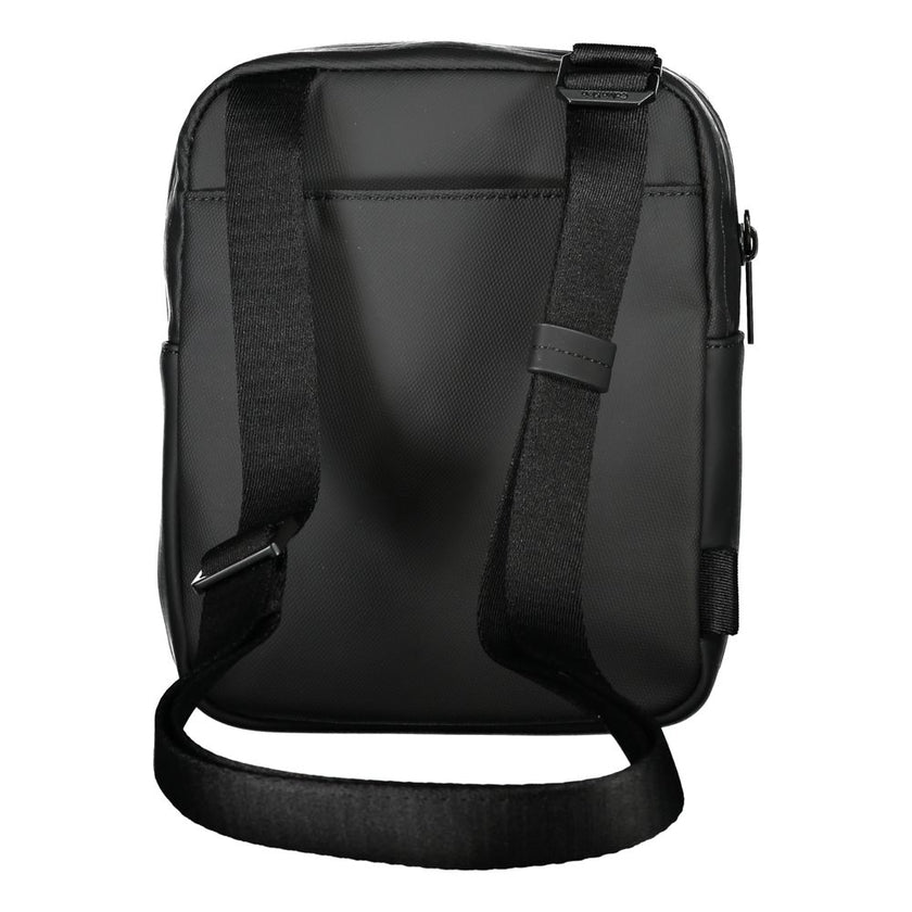 Sleek Black Recycled Polyester Shoulder BagExperience the perfect blend of functionality and style with this sleek Calvin Klein shoulder bag. Crafted for the environmentally conscious, it features an adjustable shoulder strap for customized comfort and an