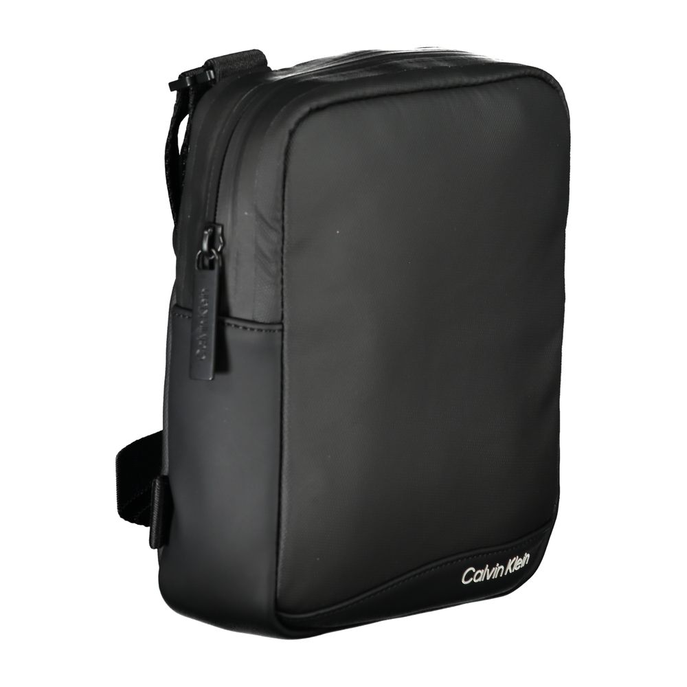 Sleek Black Recycled Polyester Shoulder BagExperience the perfect blend of functionality and style with this sleek Calvin Klein shoulder bag. Crafted for the environmentally conscious, it features an adjustable shoulder strap for customized comfort and an