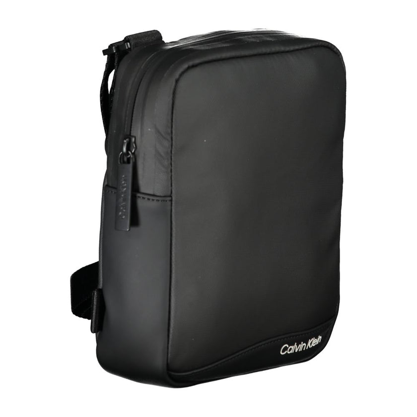 Sleek Black Recycled Polyester Shoulder BagExperience the perfect blend of functionality and style with this sleek Calvin Klein shoulder bag. Crafted for the environmentally conscious, it features an adjustable shoulder strap for customized comfort and an