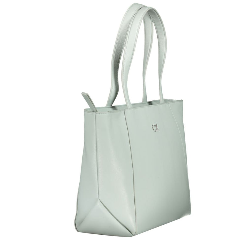 Light Blue Polyethylene Women HandbagElevate any ensemble with the latest Calvin Klein masterpiece, a vision in light blue that effortlessly merges function with high-end fashion. This sleek handbag boasts two shoulder straps for versatile carry and a sol