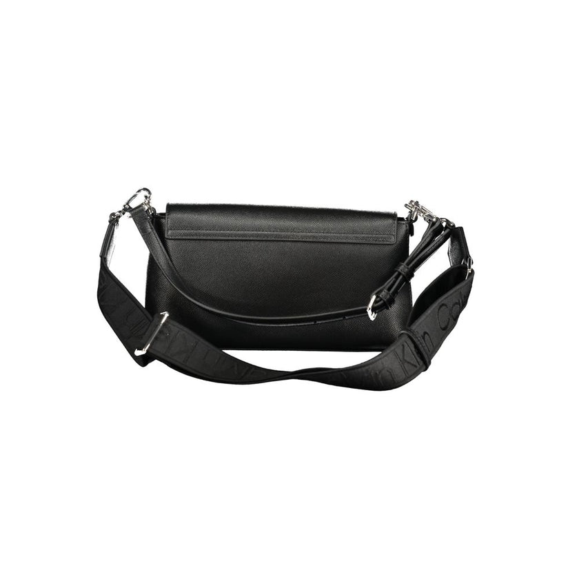 Black Polyethylene Women HandbagElevate your ensemble with the sleek sophistication of a Calvin Klein handbag, a quintessential accessory for the modern fashionista. Crafted from durable polyethylene, this chic black bag seamlessly transitions from daytim