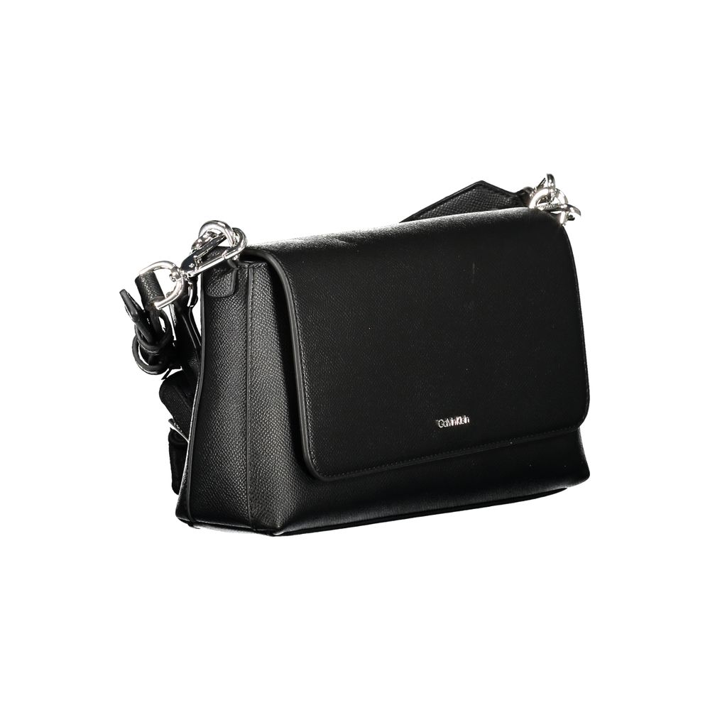 Black Polyethylene Women HandbagElevate your ensemble with the sleek sophistication of a Calvin Klein handbag, a quintessential accessory for the modern fashionista. Crafted from durable polyethylene, this chic black bag seamlessly transitions from daytim