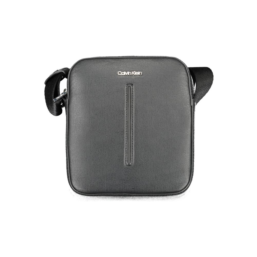 Black Polyester Men Shoulder BagElevate your style game with the Calvin Klein Eco-Conscious Shoulder Bag — a testament to modern elegance and ethical fashion. Crafted with 100% recycled polyester, this sleek black bag is a statement of refined durability