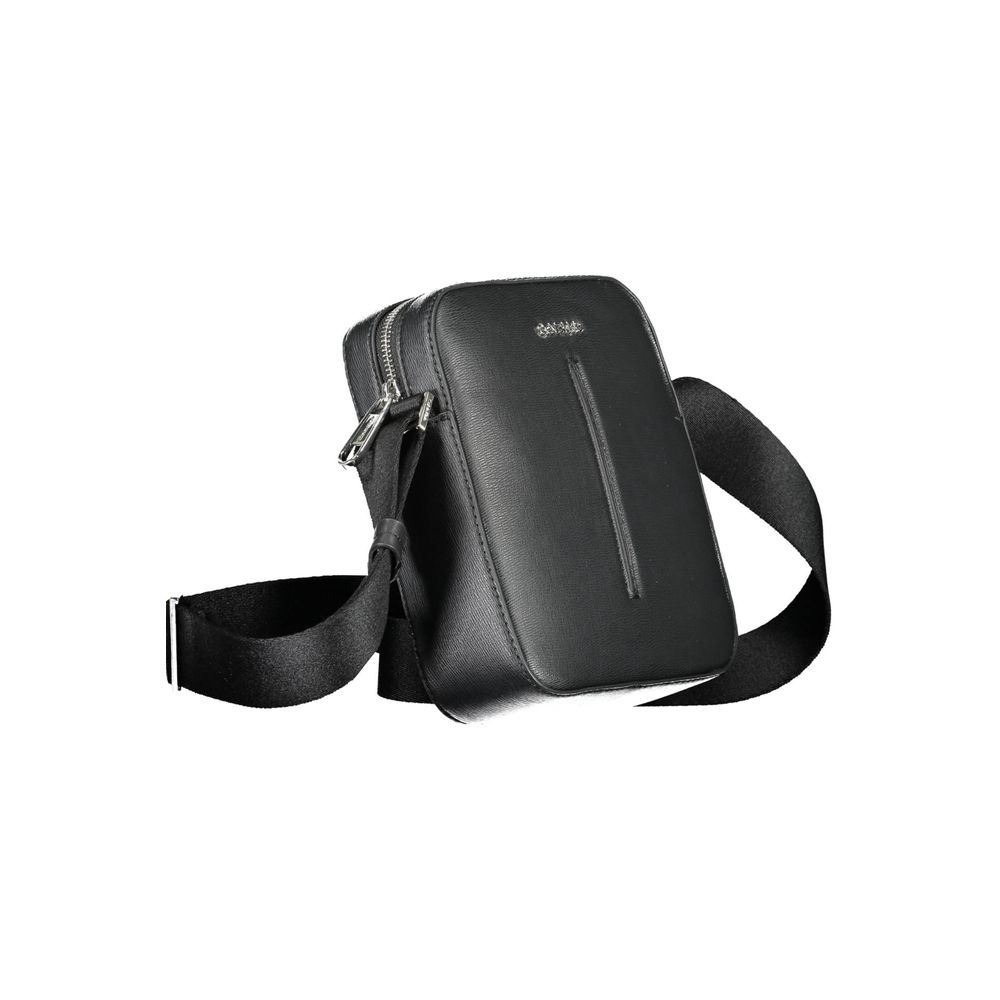 Black Polyester Men Shoulder BagElevate your style game with the Calvin Klein Eco-Conscious Shoulder Bag — a testament to modern elegance and ethical fashion. Crafted with 100% recycled polyester, this sleek black bag is a statement of refined durability