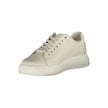 Beige Leather Women SneakerExperience the fusion of style and comfort with these Calvin Klein sneakers. Their beige sophistication is highlighted by contrasting details and the iconic Calvin Klein logo that effortlessly sets you apart from the crowd. Craf