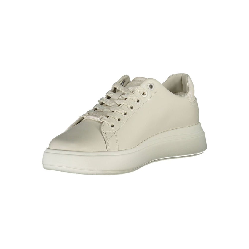 Beige Leather Women SneakerExperience the fusion of style and comfort with these Calvin Klein sneakers. Their beige sophistication is highlighted by contrasting details and the iconic Calvin Klein logo that effortlessly sets you apart from the crowd. Craf